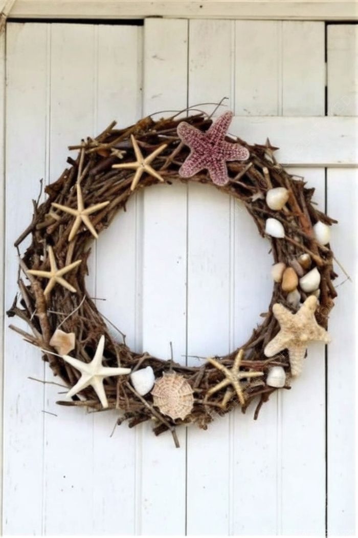 Rustic nautical wreath made of twigs adorned with starfish and shells, displayed on a white wooden door for coastal charm.