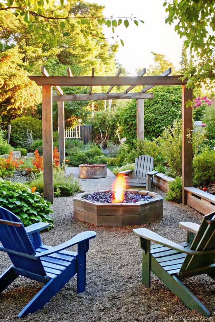 Serene garden with a stone fire pit surrounded by colorful Adirondack chairs under a wooden pergola, perfect for outdoor gatherings.